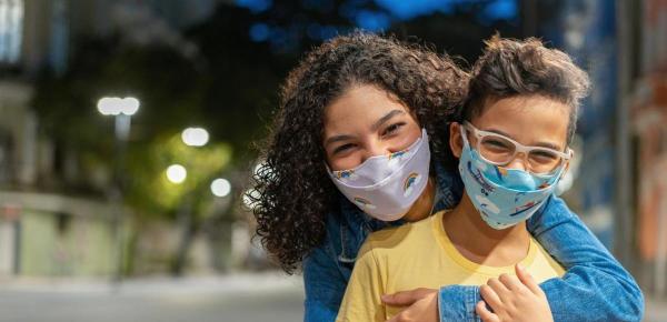 Parent with child responsibly wearing face masks